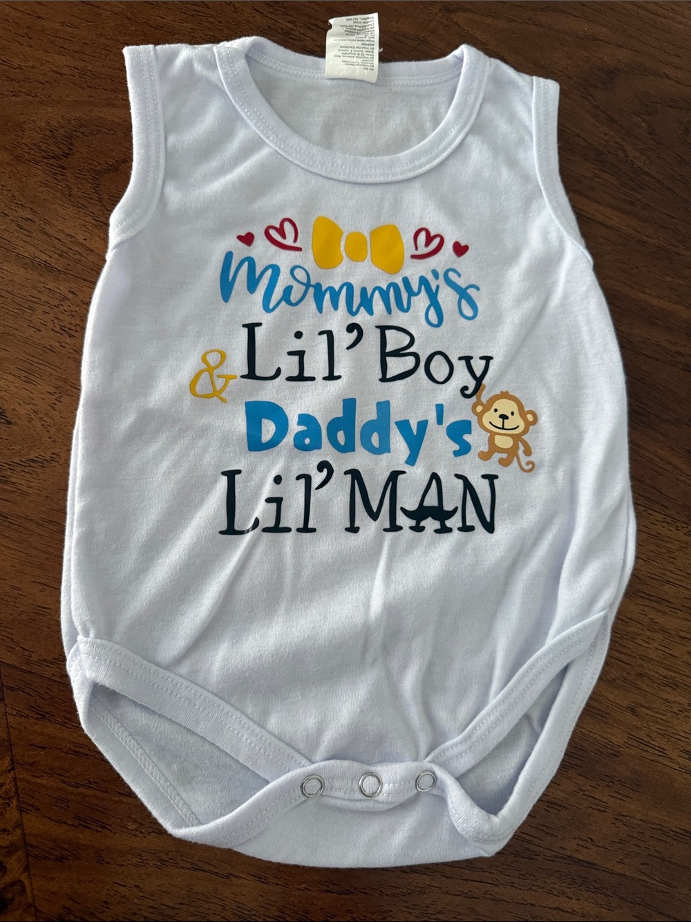 SHEIN White Sleeveless Bodysuit with Blue, Yellow, Red and Tan Graphics